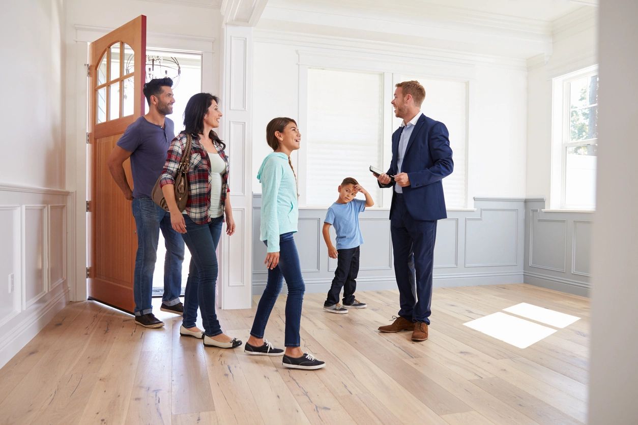 A family of four looking at their potential new home