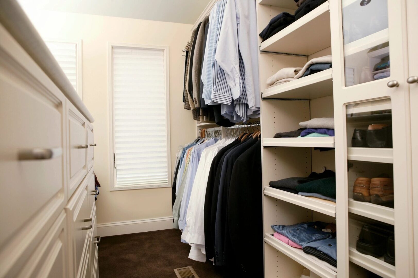 A closet filled with men’s clothes