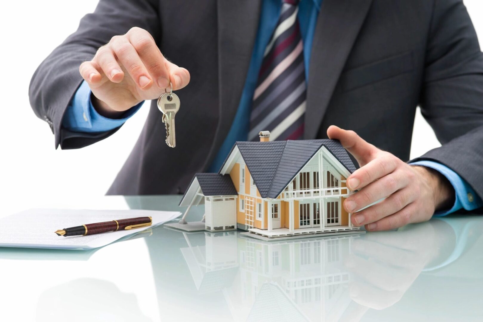 A man offering the keys to a house